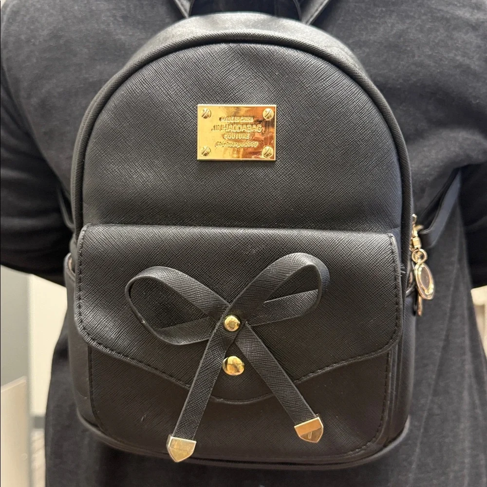Black Backpack with Gold Accents